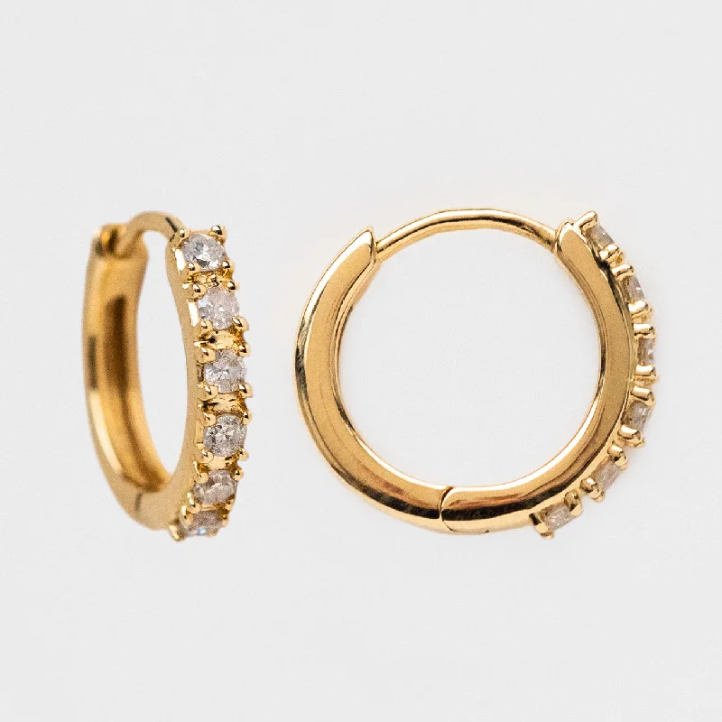 Hoop earrings with leather accents for a sleek and bold combination-Solid Gold Diamond Huggie Hoops