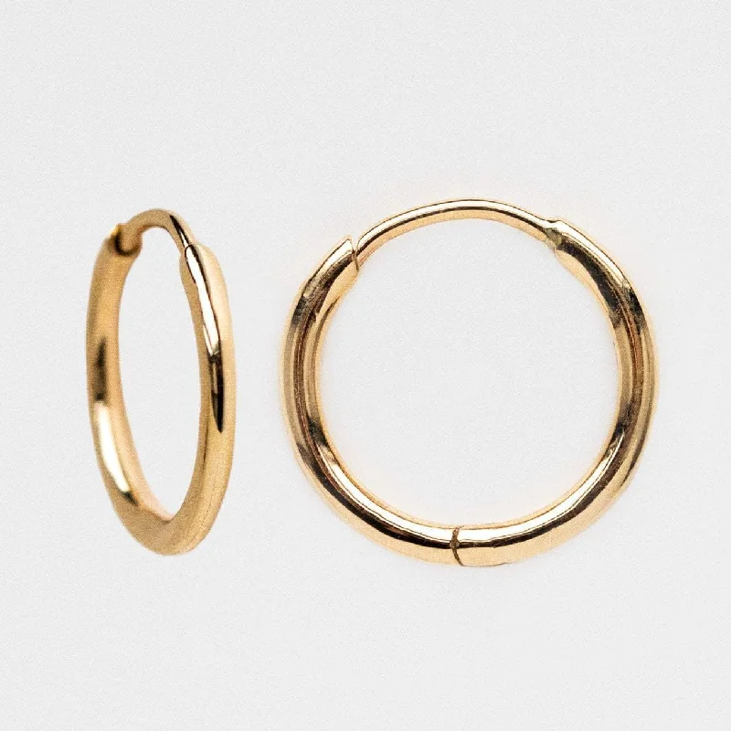 Hoop earrings with leather accents for a sleek and bold combination-Solid Gold Simple Huggie Hoops