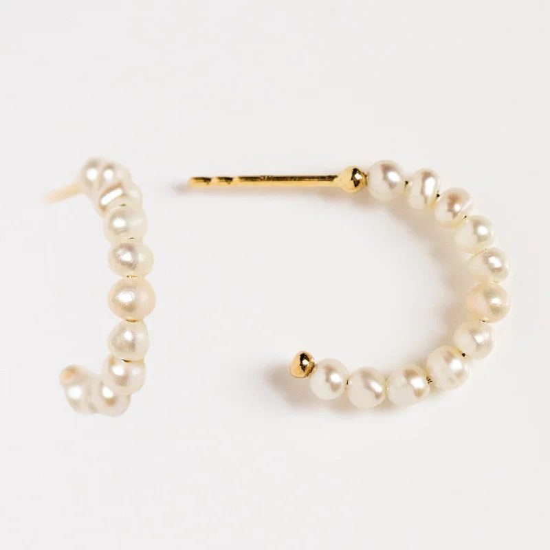 Best hoop earrings with matte finish for a sophisticated, understated design-Solid Gold Simple Pearl Huggie Hoops