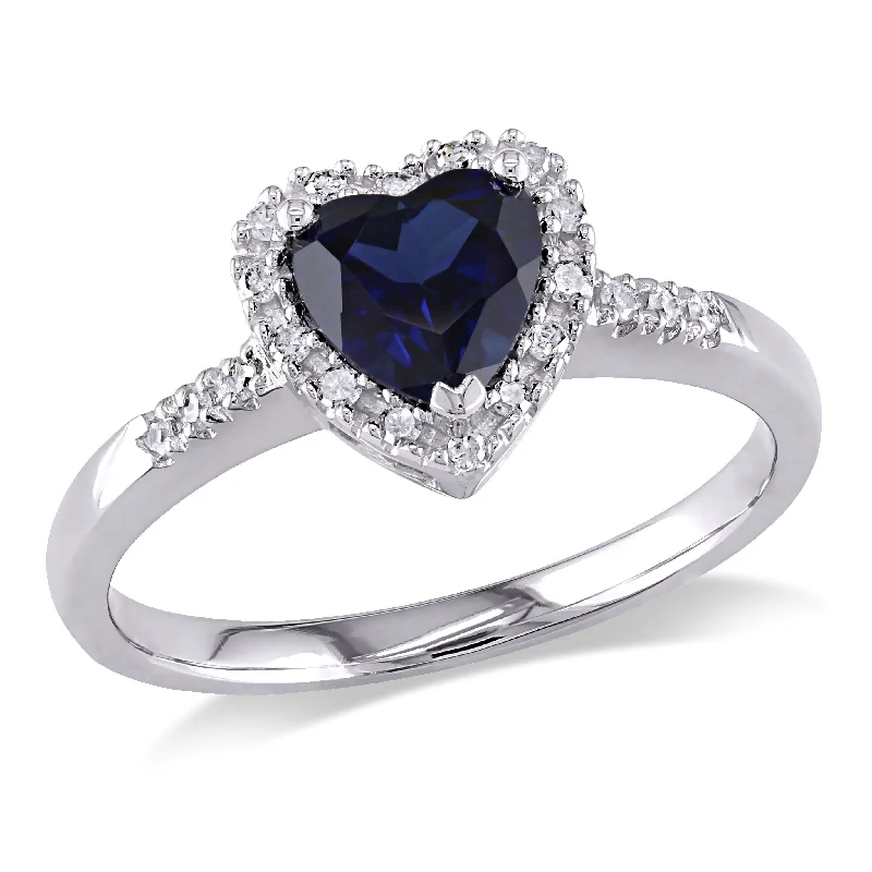 Rings with floral halo diamond arrangements -1/10 CT TW Halo Diamond and 7/8 CT TGW Heart Shaped Created Blue Sapphire Ring in 10K White Gold