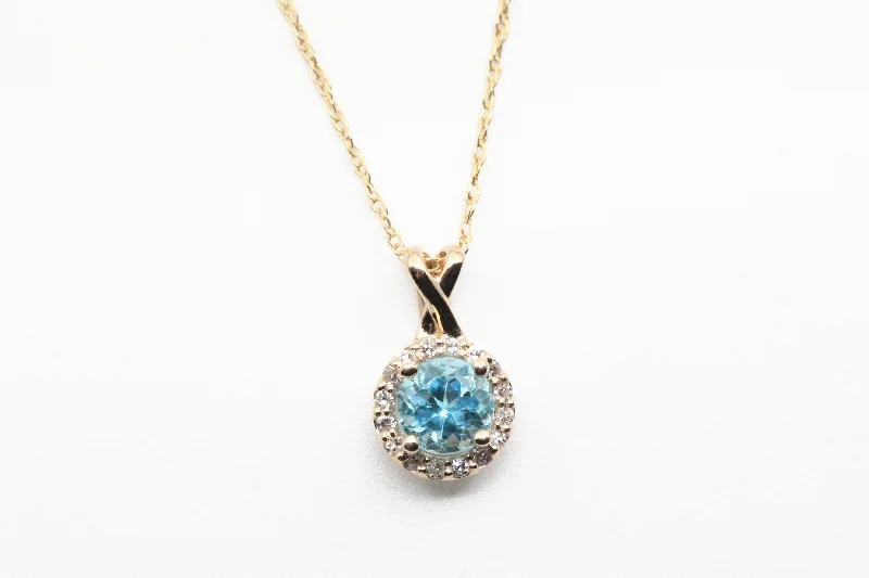 Unique necklaces and pendants with gemstones for a colorful and vibrant statement-Yellow Gold Blue Topaz Pendant with Diamond Halo