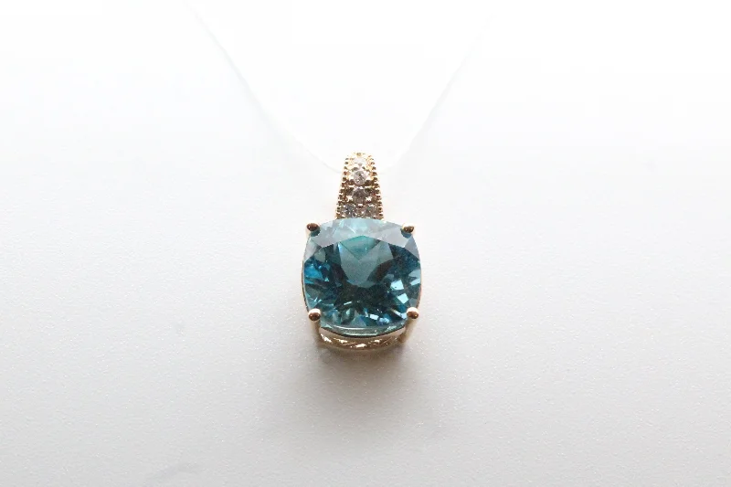 Best necklaces and pendants with opal and gold for a vibrant, luxurious contrast-Yellow Gold Cushion Blue Topaz Pendant