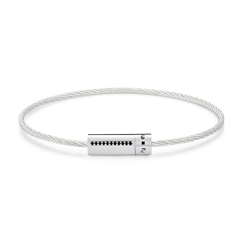 Chunky bangle bracelets with metallic finishes for a bold and statement-making look-LE GRAMME MEN'S 7G SILVER AND BLACK DIAMOND ACCENTED CABLE BRACELET