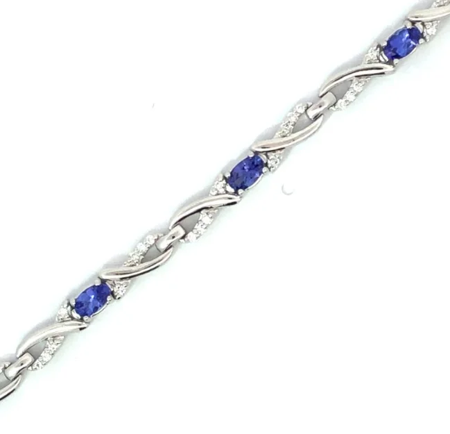 Stacked bangle bracelets with alternating textures for a dynamic, trendy look-14W Infinity Link Round Diamond and Oval Tanzanite Bracelet