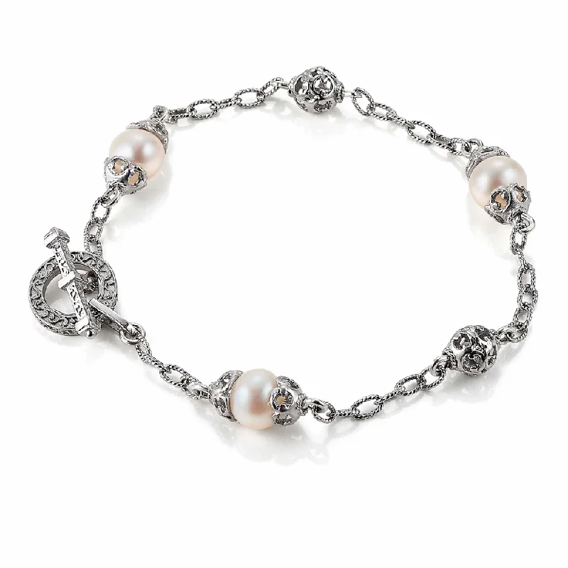 Elegant bangle bracelets with diamond-cut designs for added sparkle and elegance-Filigree Bead and Pearl Station Bracelet