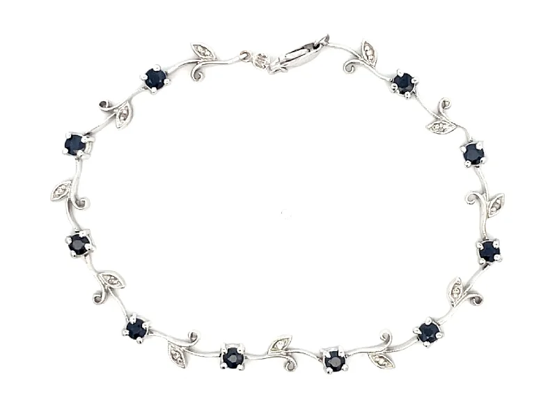 Sleek bangle bracelets with black enamel for a sophisticated and modern look-Sapphire Flower Diamond Leaf Bracelet in 14k White Gold