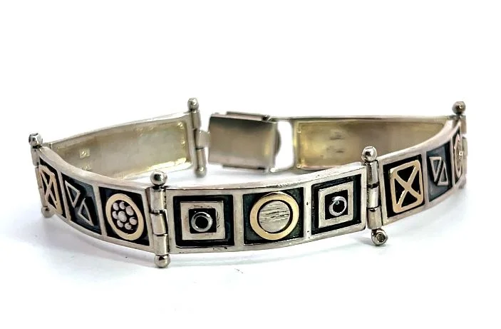 Best silver bangle bracelets with intricate detailing for a timeless and sophisticated style-Sterling Silver Modernist Jerusalem Bracelet with Garnet Accents 7.25"