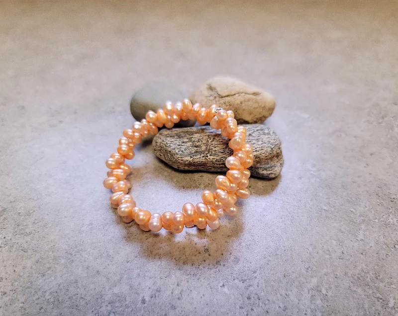 Best bangle bracelets with sapphire stones for an elegant and rich pop of color-Peach Ocean's Embrace Bracelet