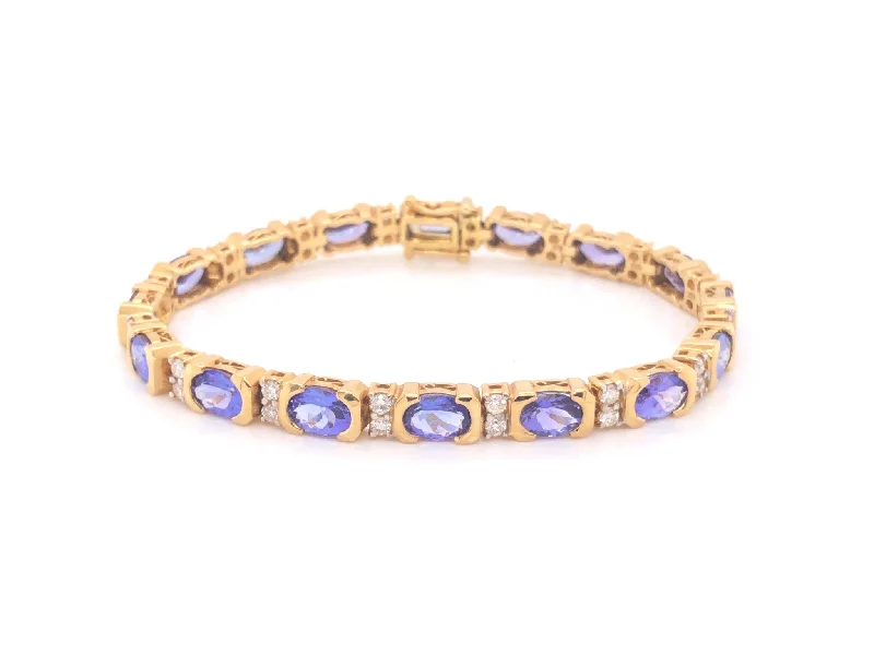 Simple bangle bracelets with open designs for a trendy and minimalist style-11 Carat Tanzanite and Diamond Link Bracelet 18k Yellow Gold